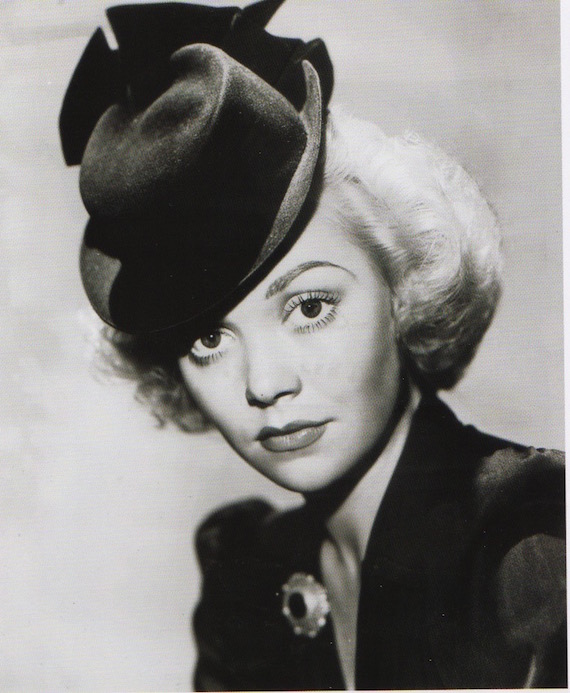 An actress showing a fashionable hat. An actress showing a fashionable hat.