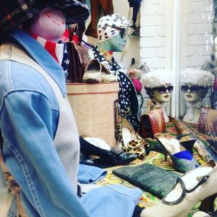 What is the definition of vintage clothing. Blue17_vintage_shop_london_window_display_ photo