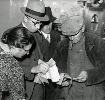 what are the best workwear jacket brands.One Woman and two Men , one wearing workwear jacket, Netherlands, 1941