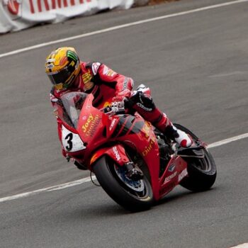 What are the best motorcycle jacket brands - John McGuinness riding at the Dainese Superbike TT 2013.