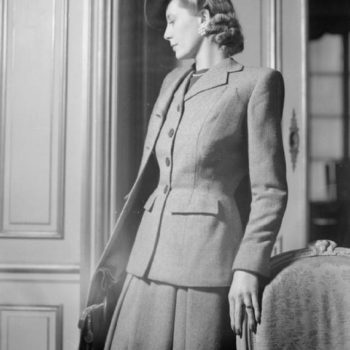 40s 50s Fashion - model wears a wool checked suit by fashion designer Hardy Amies, 1945