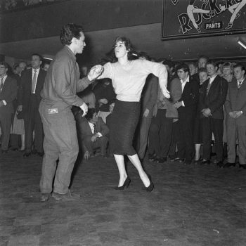 Rockabilly couple jiveing at Rock and Roll dance in 1957