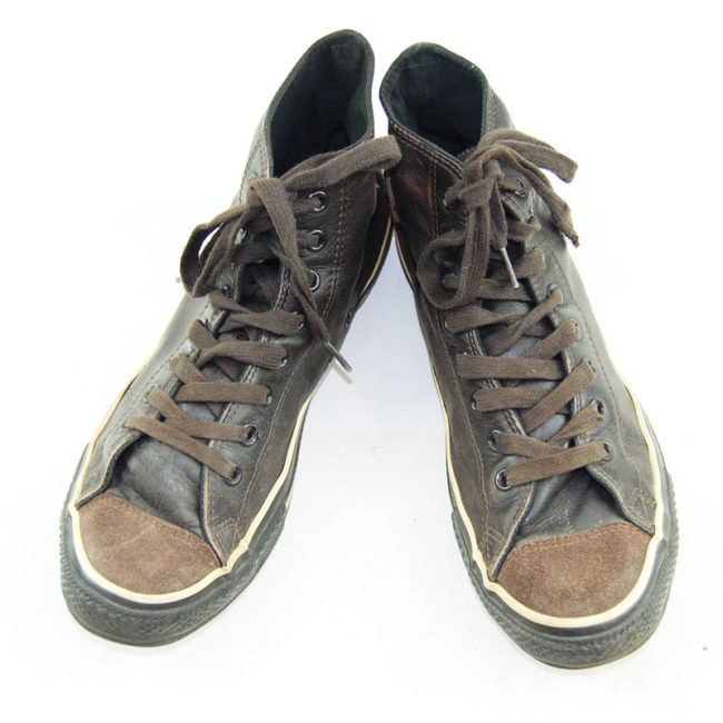 blue and brown leather converse