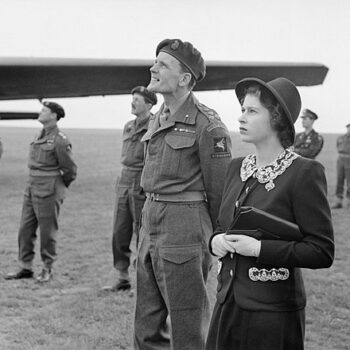 The Queen loves pockets too! HRH Princess Elizabeth watching parachutists dropping during a visit to airborne forces in England, 1944