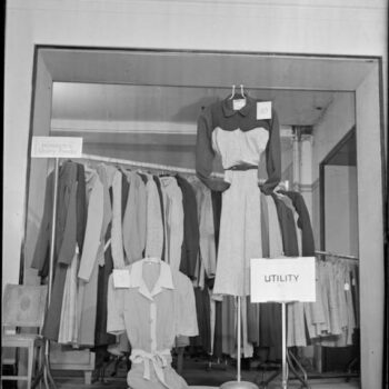 1940s haute couture. Norman Hartnel Utility designs in a shop display.