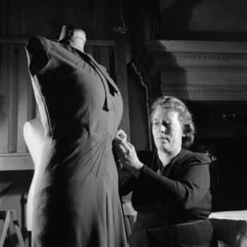 What Are The Best Websites To Buy British Designer Vintage Clothing - Seamstress In the workrooms of the fashion designer Norman Hartnell in London, 1944