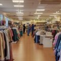 Are Thrift Stores Profitable - The interior of a successful thrift store, showcasing a clean and well-organized layout with attractive displays of high-quality merchandise.